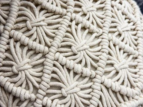 Closeup of macrame pattern with woven ropes. Handmade textile craft, bohemian Stock Photos