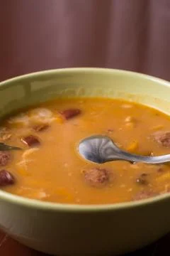 Closeup macro angle of cooked beans with sausages served in the bowl Stock Photos