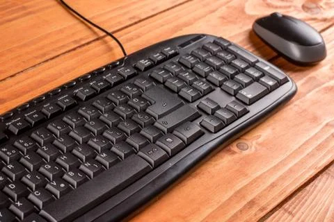 Closeup macro black pc keyboard with black wireless mouse Stock Photos
