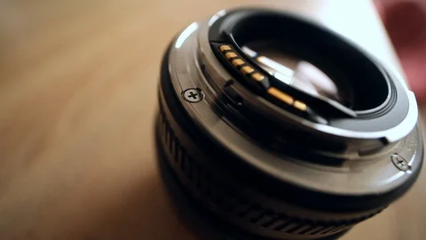 Closeup macro of camera lens with sun light on blurred background. Detail 스톡 동영상 126768966