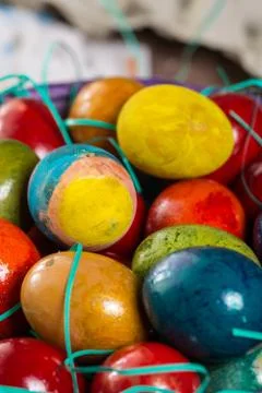 Closeup macro of colored Easter eggs in the basket Stock Photos