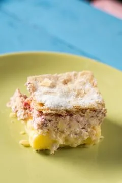 Closeup macro of cream pie with raspberry on the plate in natural light Stock Photos