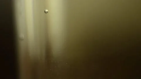 Closeup macro drink water bubbles are going up in the cup Stock Footage 138222247