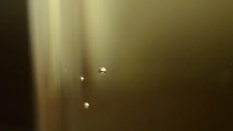 Closeup macro drink water bubbles are going up in the cup Stock Footage 138222257