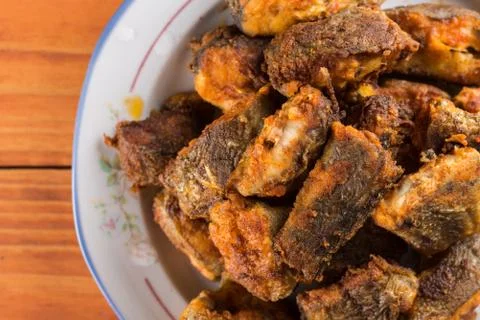 Closeup macro flat lay above served fried hake on the plate Stock Photos
