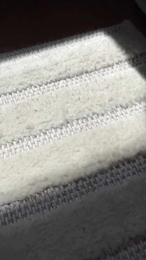 Closeup Macro Footage of Soft White Carpet Texture With Woven Stripe Pattern  Stock Footage 334673377