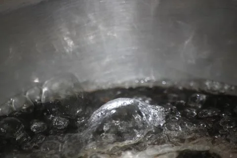 Closeup macro photograph with selective focus of boiling water Stock Photos