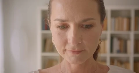 Closeup macro portrait of elderly caucasian brunette female looking at camera Video stock 112604742