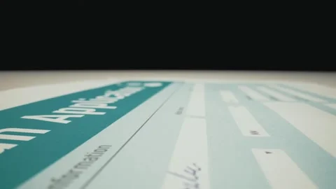 Closeup macro shot movement of hand filling loan application. Stock Footage 241006645