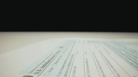 Closeup macro shot movement shot of corporate accountant lling 1040 tax form. Stock Footage 245493870