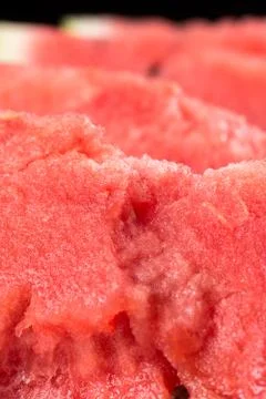 Closeup macro slices of watermelons background fruits. Stock Photos