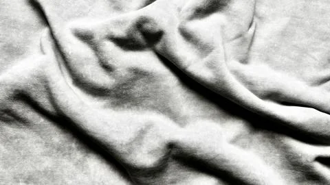 Closeup macro texture of softly crumpled light gray fabric with intricate wri Stock Photos