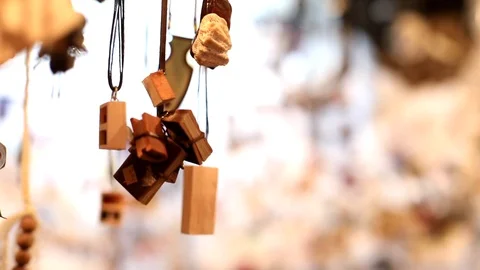 Closeup macro view of cute handmade jewelry pendant hanging up in stylish ethnic Vidéo 116267903