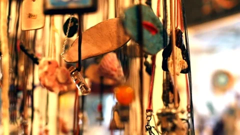 Closeup macro view of many handmade jewelry pendants hanging up in stylish 스톡 동영상 116267980