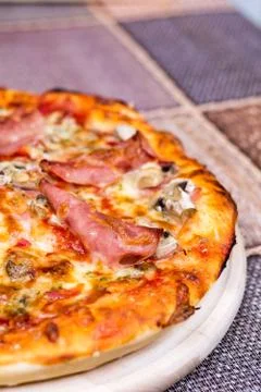 Closeup macro view pizza with ham cheese mushrooms Stock Photos