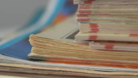 Closeup macro view of stack of old vintage magazines Stock Footage 154294643
