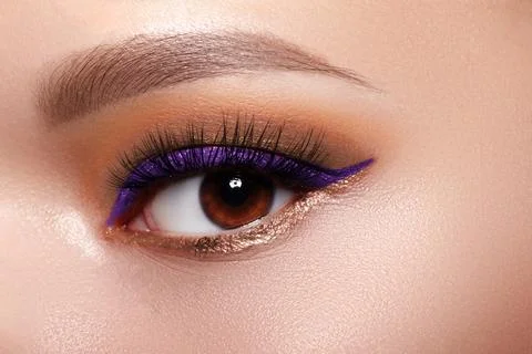 Closeup macro of womans face with bright make-up. Fashion festive makeup with Stock Photos