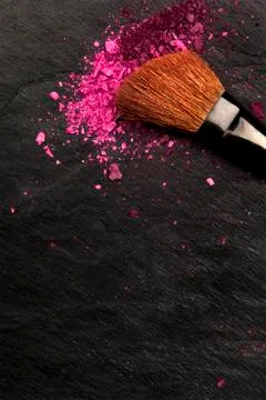 Closeup of makeup brush with eye shadow on black with place for text 写真素材