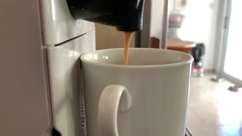 Closeup making coffee from a capsule in an automated Nespresso machine. Coffee d Vídeo Stock 218232585