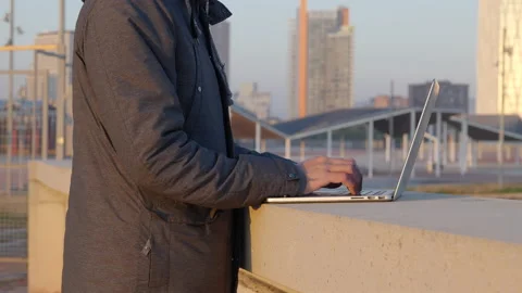 Closeup on male hacker typing security code on laptop at Barcelona Stock Footage 166609443
