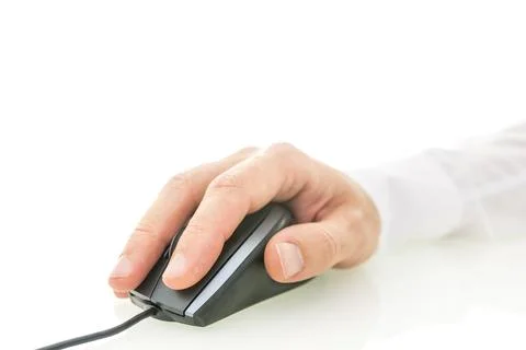 Closeup of male hand using computer mouse. Over white background. Empty spa.. Stock Photos