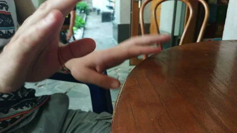 Closeup male hands tapping on the table Stock Footage 112384924