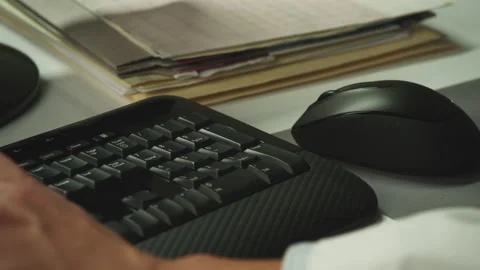 Closeup of male hands typing at a work desk computer Stock Footage 146361090