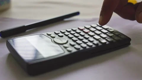 Closeup of a male student using a math function calculator or scientific ca.. Stock Footage 241175873