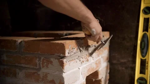Closeup of Man Assembling Small Brick Stove Vídeo Stock 347850447