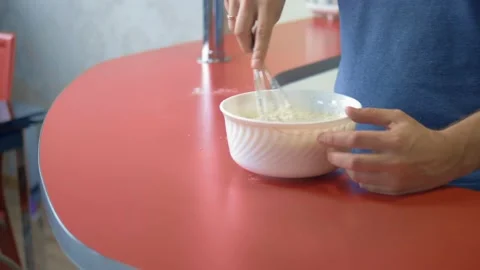 Closeup. A man beats eggs with flour. make dessert in the home kitchen Stock-Footage 131035879