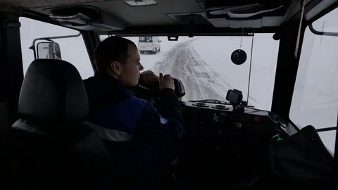 Closeup Man in Cabin Drives Car along Road Turns Right Stock Footage