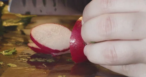 Closeup of a Man Chopping a Radish Stock Footage 142407048