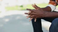 Closeup Man Clasping Hands On Sunny Day Stock Footage