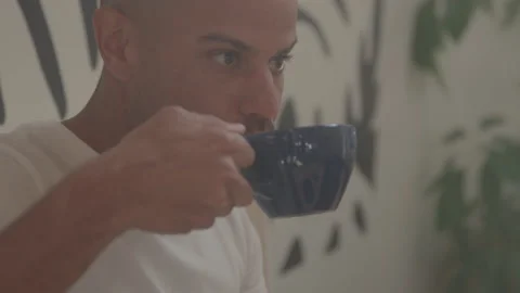 Closeup of a Man at a Coffee Shop Taking a Sip of a Latte Vidéo 208802065