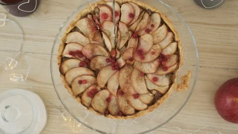 Closeup of Man Cutting Apple Pie in the Kitchen Stock Footage 168174053