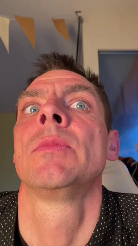 Closeup of man displaying shifting emotions suitable for viral content sharing Stock Footage 335355052