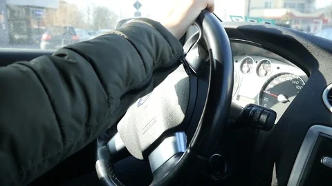 Closeup Of a Man Driver's Hands On Steering Wheel of a Car Ford Stock Footage 86210647