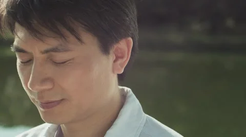Closeup of a man enjoying his time at waterside Video stock 58994884