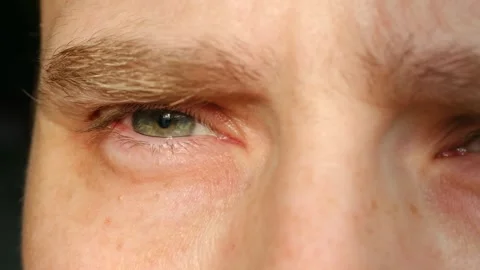Closeup of man expressing deep thought and subtle vulnerability within cinematic Video stock 337546941