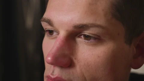 Closeup of man Face, man has beautiful brown Eyes. Natural Beauty. Slow motion. Stock Footage 148384216