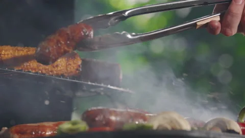 Closeup Of A Man Grilling Barbeque. Video stock 211753232