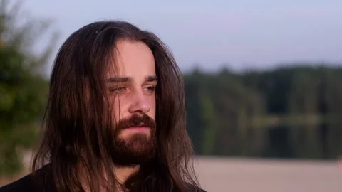 Closeup of Man with guilty face at river shore background. Stock Footage 120513134