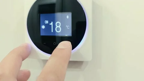 Closeup the man hand controls and presses the buttons The air conditioning and Stock Footage 221565218