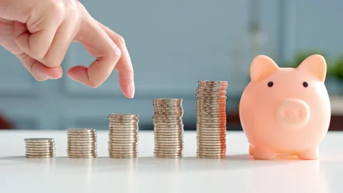 Closeup man hand finger step up on stacking coins, save money and growth Stock Footage 147151803