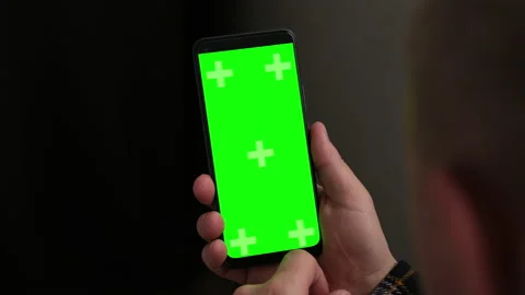 Closeup man Hand is Holding Chroma Key Green Screen in vertical Position Video stock 236476023