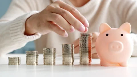 Closeup man hand stacking coin for save money concept Stock Footage 147141701