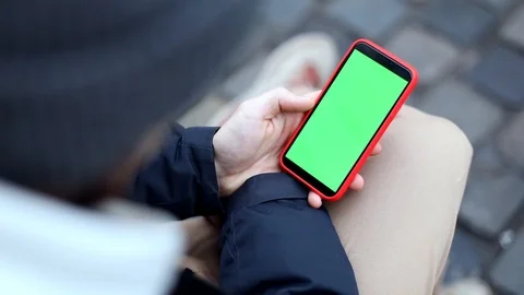Closeup of man hand using green screen smartphone mobile outside. Winter holiday 스톡 동영상 120626847