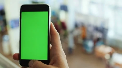 Closeup man hand using smart phone application pointing green screen touching Stock Footage 81582979