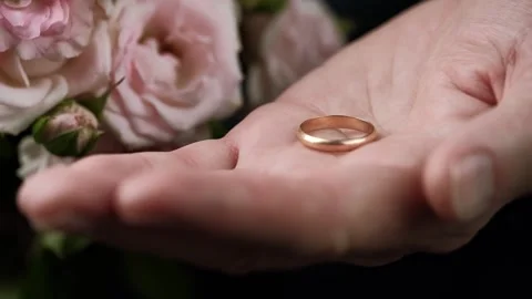 Closeup of man hand with wedding ring on palm. man makes a marriage proposal. Stock Footage 251553509