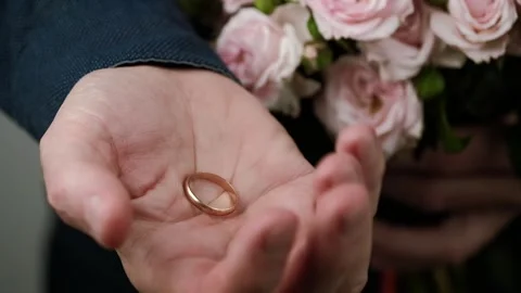 Closeup of man hand with wedding ring on palm. man makes marriage proposal. Stock Footage 252070352